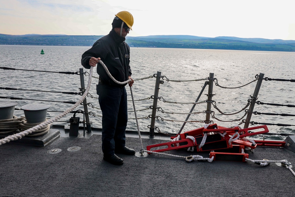 Boatswain’s Mate prepares a ladder for a visiting pilot