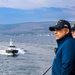 A pilot boat approaches the USS Bulkeley