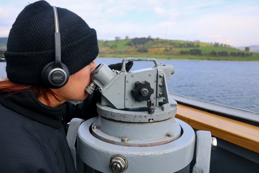 U.S. Nay Sailor verifies visual contacts aboard the USS Bulkeley