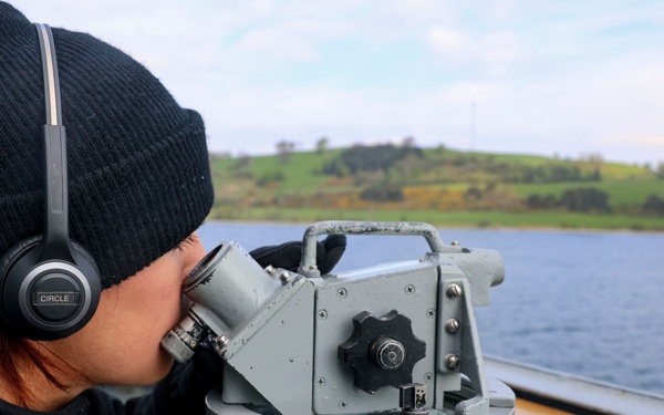 U.S. Nay Sailor verifies visual contacts aboard the USS Bulkeley