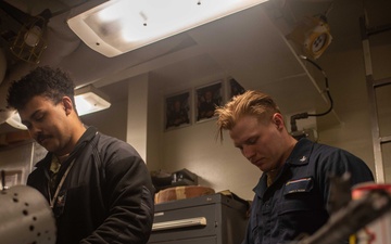 USS Ronald Reagan (CVN 76) Sailors perform weapon inspections