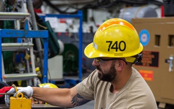 USS Ronald Reagan (CVN 76) Sailors, contractors and Puget Sound Naval Shipyard workers conduct routine operations and ship maintenance