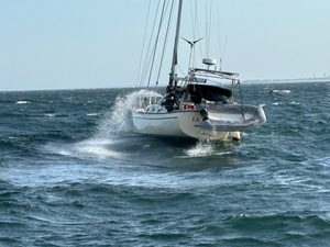 Coast Guard rescues 2 from storm-tossed sailboat