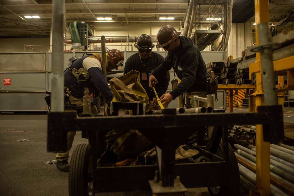 PSNS workers perform maintenance aboard USS Ronald Reagan (CVN 76)