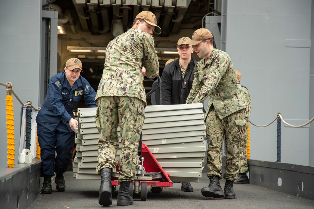 Tripoli Sailors Offload Trash