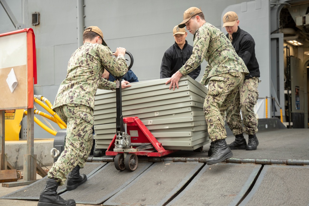 Tripoli Sailors Offload Trash
