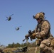 A Soldier adjusts his rifle