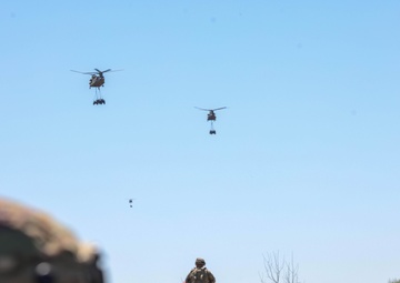 Soldiers Ready into Position as Aircraft and Vehicles Approach