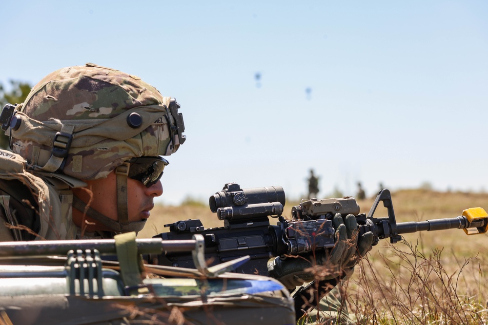 A Soldier Assumes a Prone Firing Position