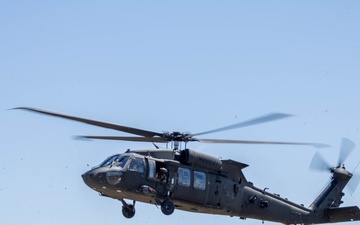 A UH-60 Blackhawk Helicopter Approaches a Landing Zone