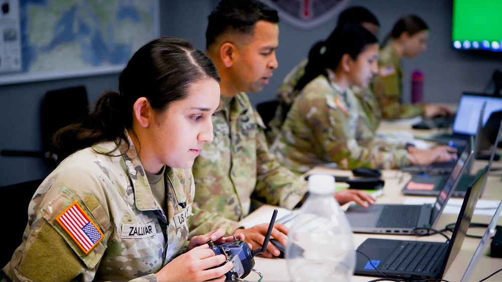 Army Specialist Samantha Zaldivar operates a homemade simulator during Chimera Sunrise