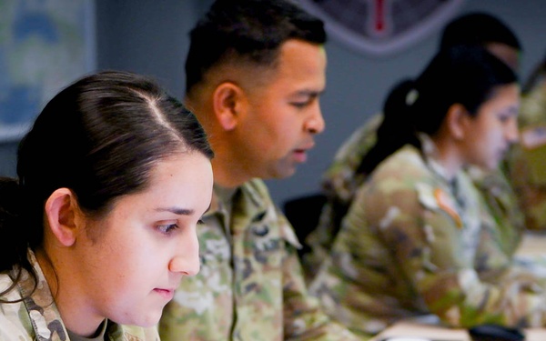 Army Specialist Samantha Zaldivar operates a homemade simulator during Chimera Sunrise