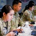 Army Specialist Samantha Zaldivar operates a homemade simulator during Chimera Sunrise
