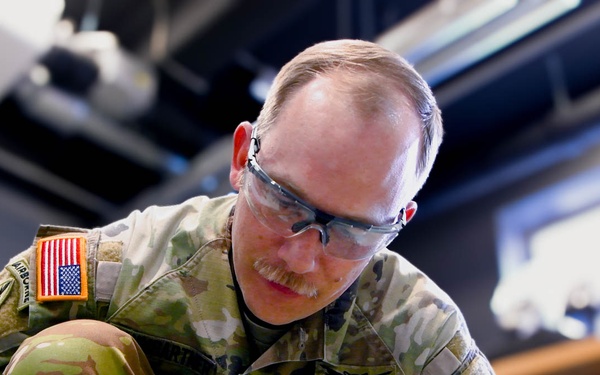 Sgt. 1st Class Tyler Tyler Baumgartner operates a homemade simulator during Chimera Sunrise