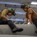 Nimitz Sailors Conduct Maintenance on Aircraft