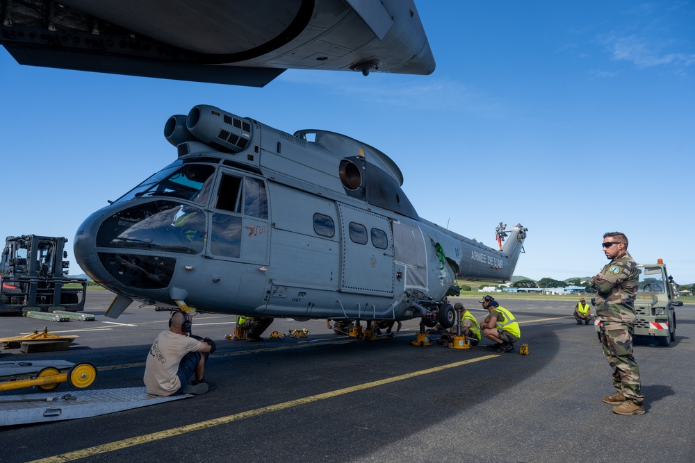 JBER aircrew, French Army work together to load Puma helicopter onto C-17