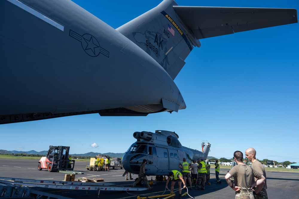 JBER aircrew, French Army work together to load Puma helicopter onto C-17