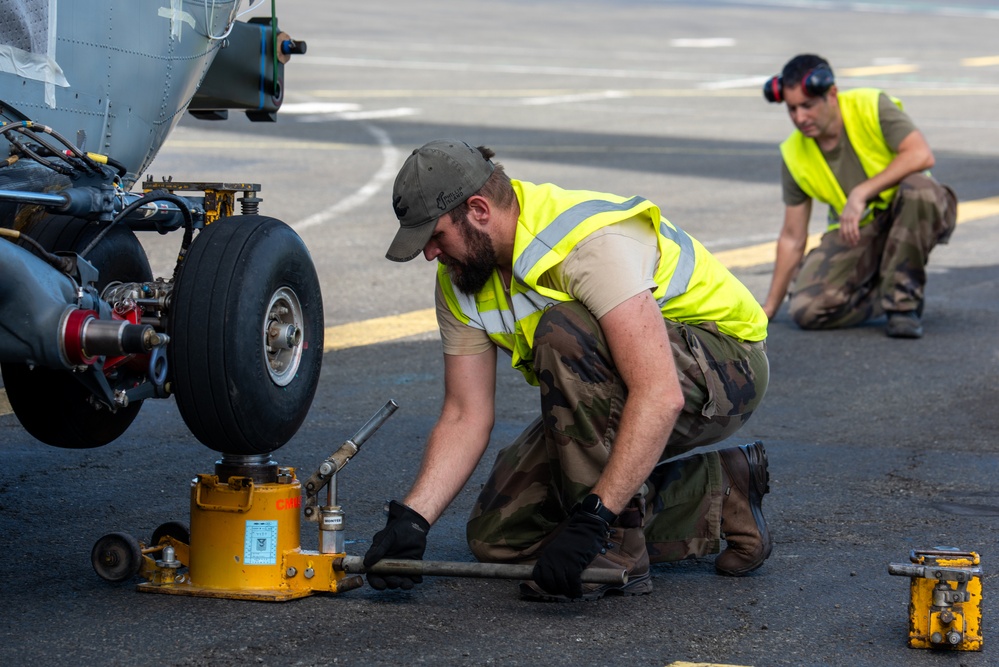 JBER aircrew, French Army work together to load Puma helicopter onto C-17