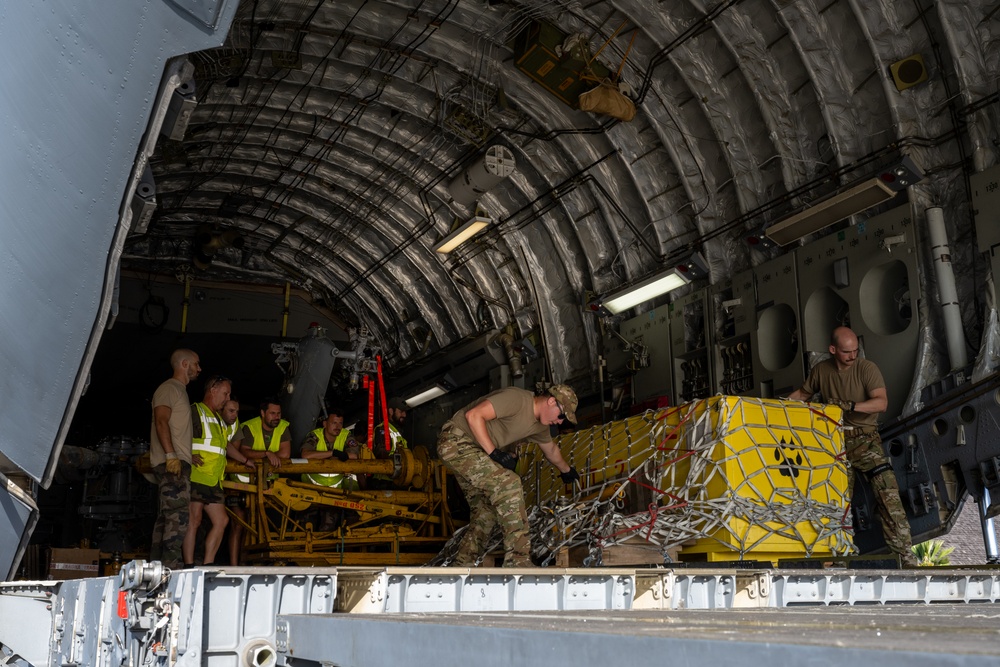 JBER aircrew, French Army work together to unload Puma from C-17