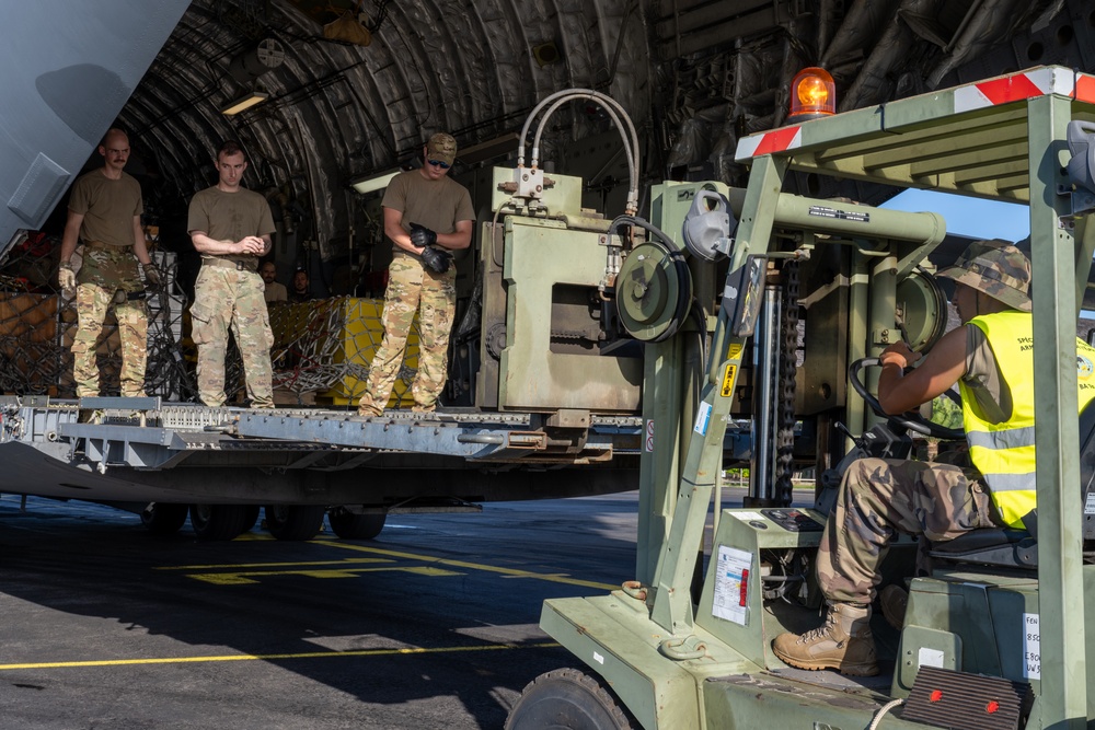 JBER aircrew, French Army work together to unload Puma from C-17