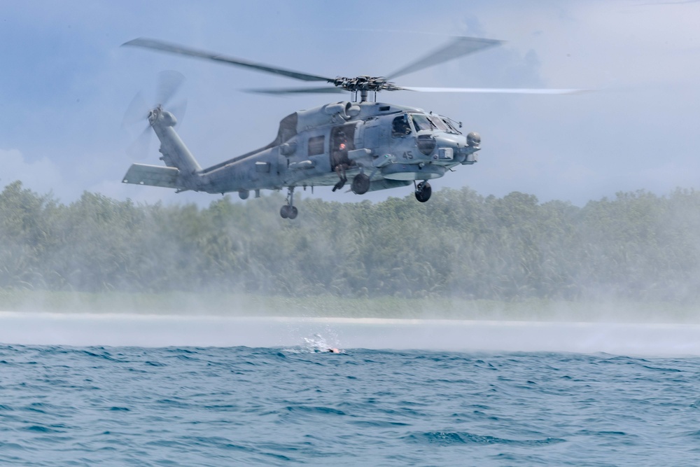 Search and Rescue Swimmers from HSM 49 det. 4 Practice Jumps off the Coast of Diego Garcia