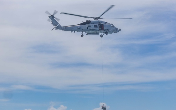 Search and Rescue Swimmers from HSM 49 det. 4 Practice Jumps off the Coast of Diego Garcia