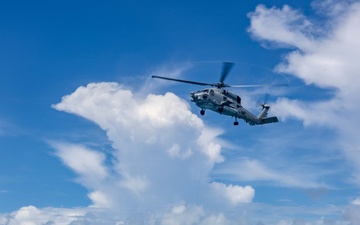 Search and Rescue Swimmers from HSM 49 det. 4 Practice Jumps off the Coast of Diego Garcia