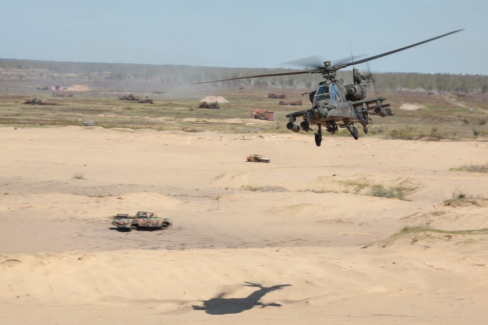 U.S. Army AH-64 Apaches roar through Latvia demonstrating lethality