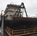 Dredge Potter maintenance to reattach the push knees to the head log.