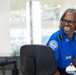 Officer screening passengers at a TSA checkpoint