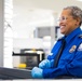 Officer screening passengers at a TSA checkpoint
