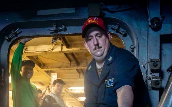 Nimitz Sailor Demonstrates A Fire Extinguisher Agent Test During General Quarters Drill