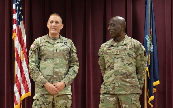 Senior Enlisted Advisor to the Chief of the National Guard Bureau, John Raines, Recognizes the Accomplishments of Newly Promoted CMSgt Kenneth Gowins