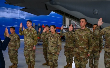 Airmen reenlist at the 129th Rescue Wing
