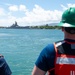 U.S. Coast Guard Cutter Stratton crew members prepare to depart Honolulu