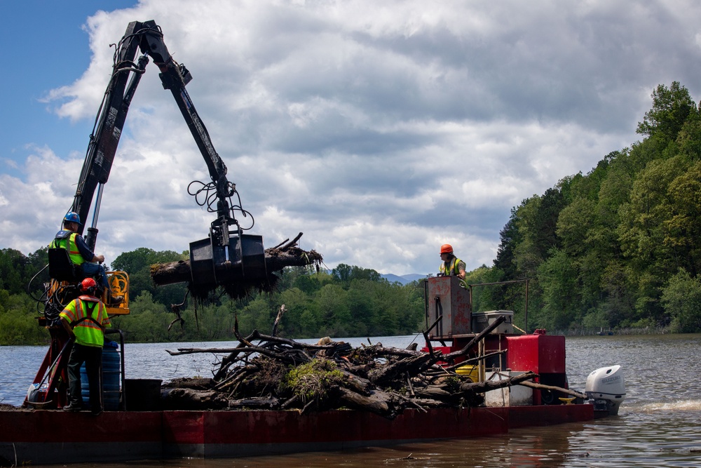 Barges remove hurricane Helene debris at Lake Emery