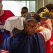 A nurse hugs a vietnam veteran returning from a honor flight