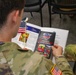 1LT Darrin Pollino reads an Honor Flight Syracuse brochure