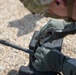 U.S. Army Sgt. William Fettig adjusts his front sight post