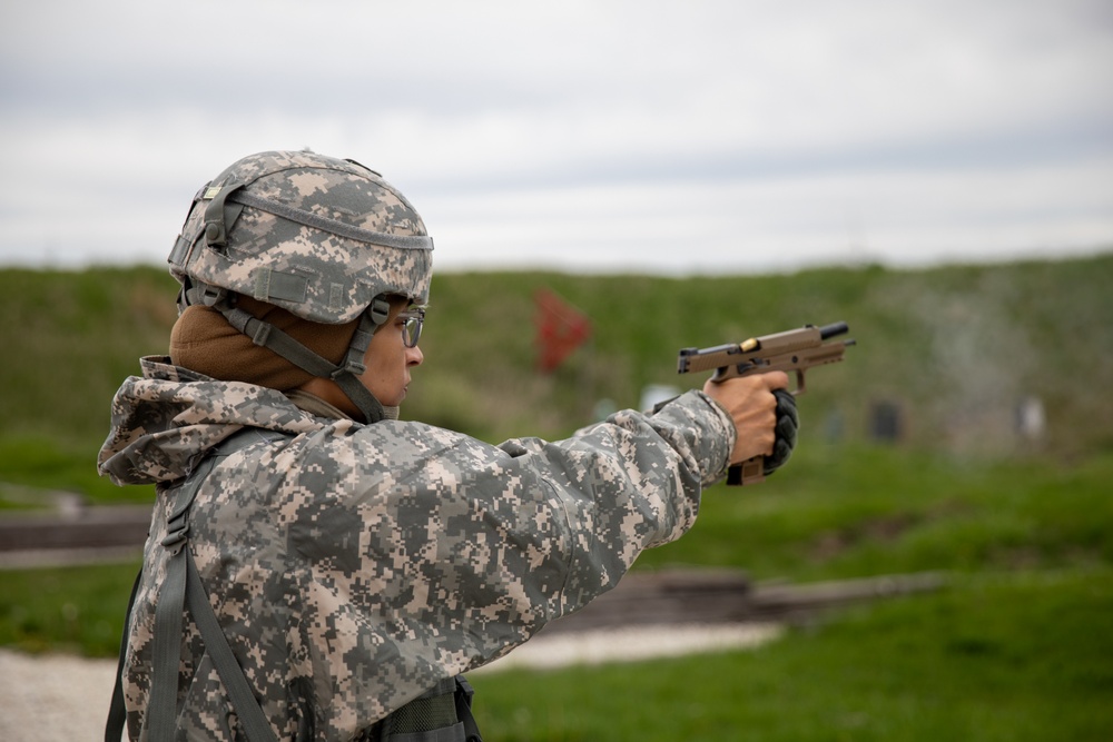 U.S. Army Maj. Jessica Modique fires her M17 pistol