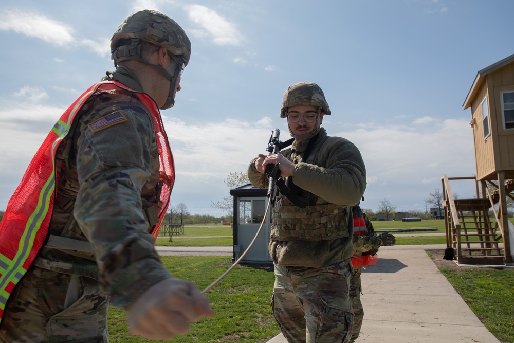 U.S. Army Spc. Trevor Seiler has his M4 carbine cleared