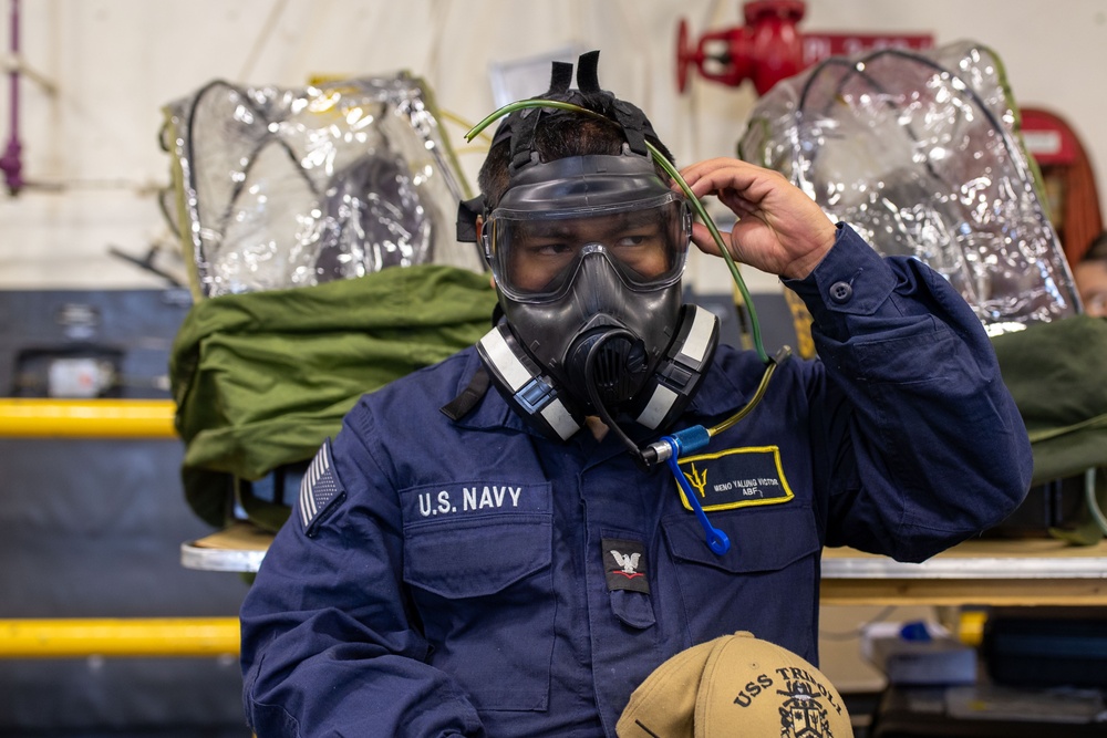 USS Tripoli Sailors Get CBR M50 Masks Fitted
