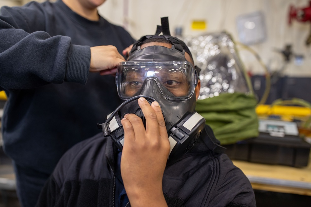 USS Tripoli Sailors Get CBR M50 Masks Fitted