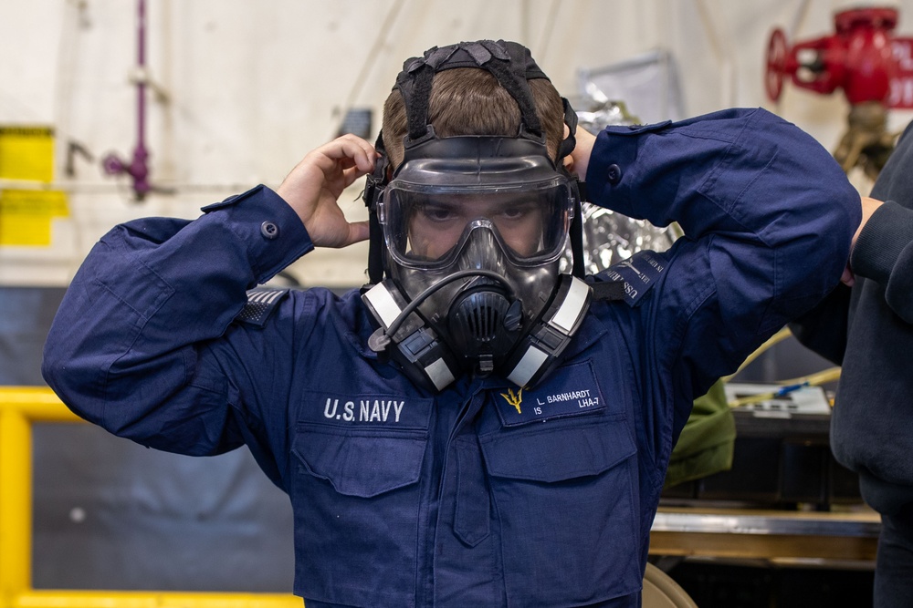USS Tripoli Sailors Get CBR M50 Masks Fitted
