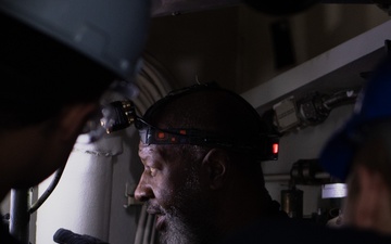 USS Ronald Reagan (CVN 76) Sailors and Puget Sound Naval Shipyard workers collaborate together