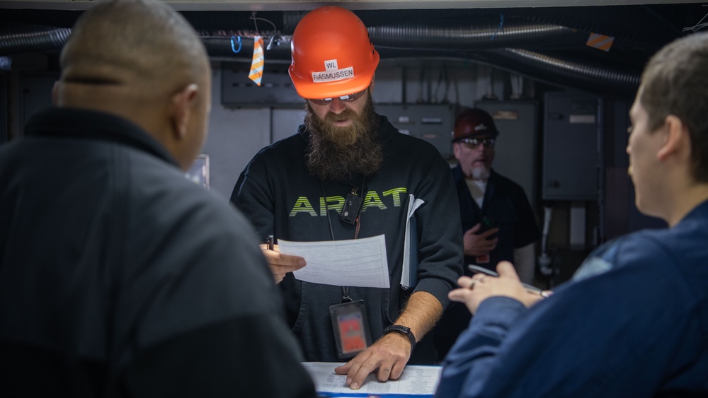 USS Ronald Reagan (CVN 76) Sailors and Puget Sound Naval Shipyard workers collaborate together