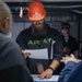 USS Ronald Reagan (CVN 76) Sailors and Puget Sound Naval Shipyard workers collaborate together