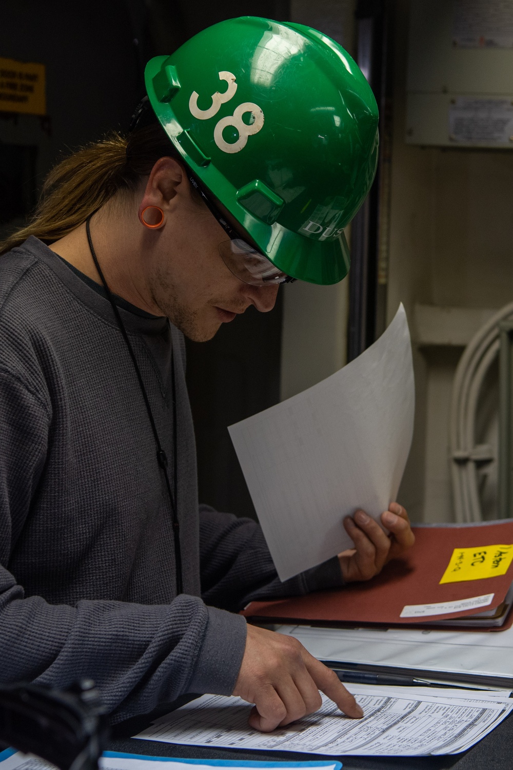 USS Ronald Reagan (CVN 76) Sailors and Puget Sound Naval Shipyard workers collaborate together