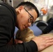 Hospital Corpsman 2nd Class Timothy Efendy demonstrates how to check cardiovascular and respiratory levels