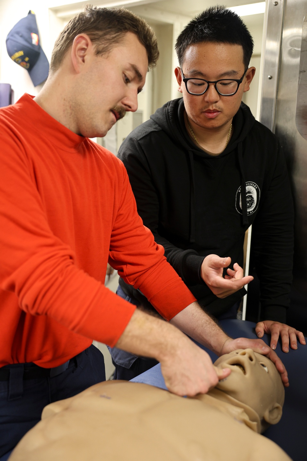 Hospital Corpsman 2nd Class Timothy Efendy demonstrates the jaw-thrust and head-tilt maneuver